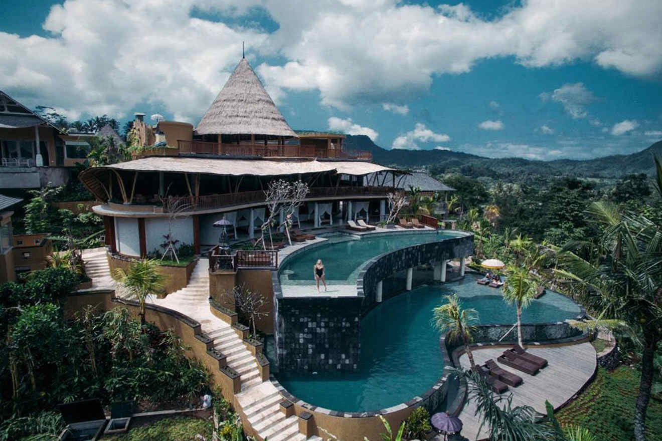 An aerial view of a resort with a couple of swimming pools