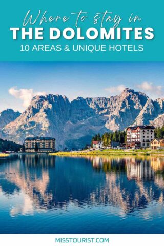 hotels and houses by the lake with the mountains in the background