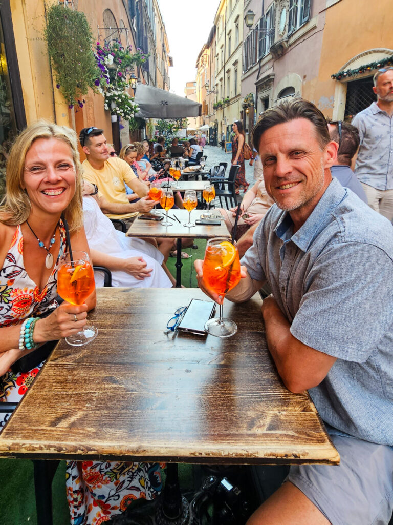 caz and craig enjoying an aperol spritz in trastevere