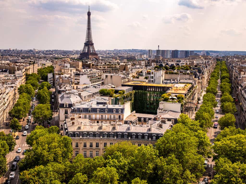 green avenues running either side of the Eiffel Tower