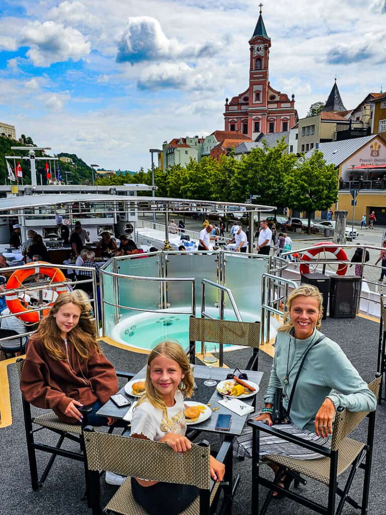 Mom and two daughters having lunch on a cruise ship