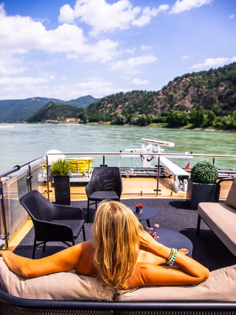 Lady sitting on couch on a river cruise