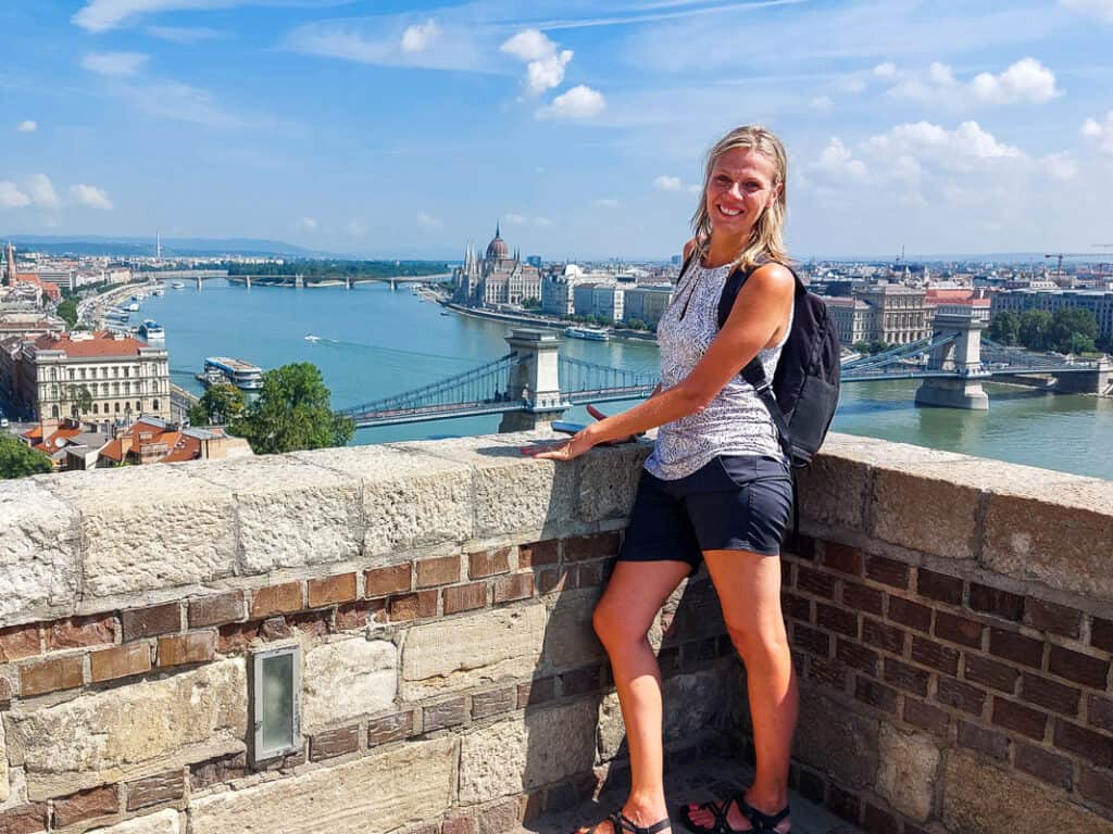 Woman overlooking a river and bridges in Budapest