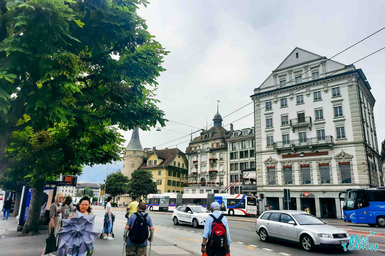 People walking down a street in a city in switzerland.