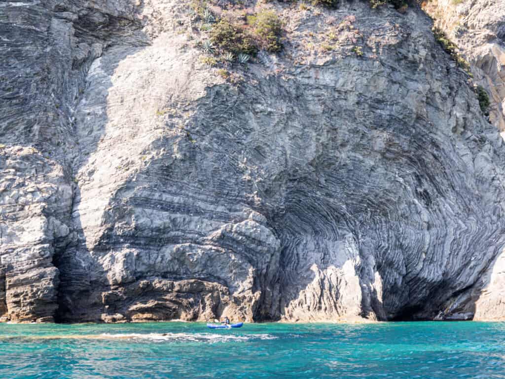 kayak next to cliff face