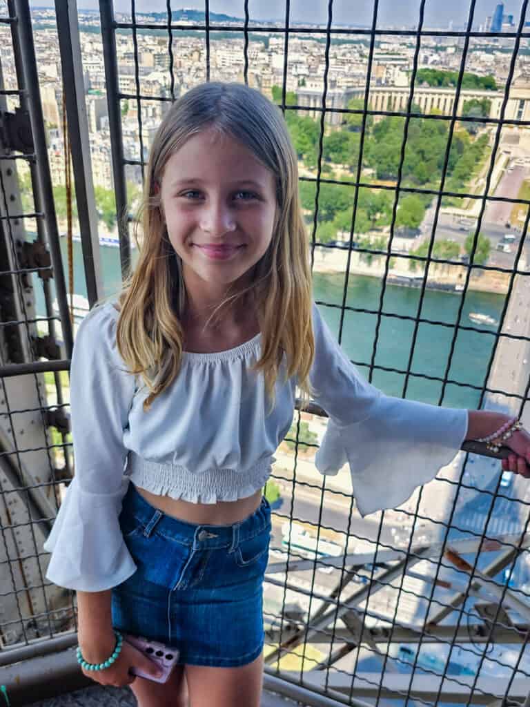 Savannah posing on eiffel tower stairs