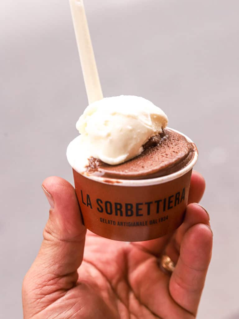 hand holding cup of chocolate and original gelato