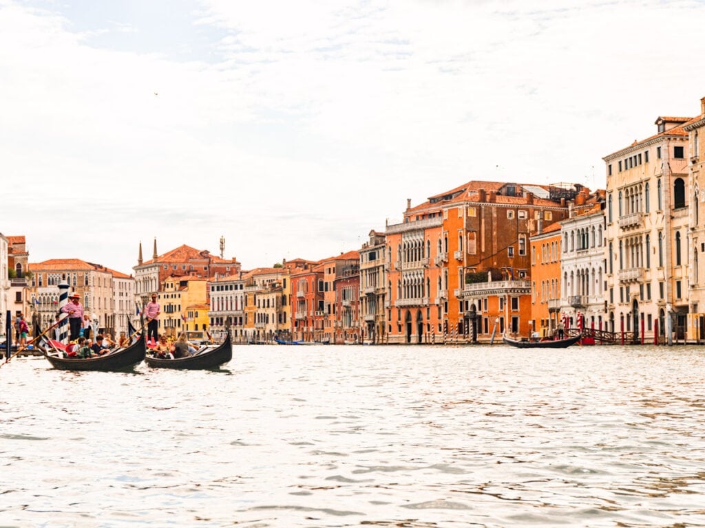 gondola on grand canal with colorful buildings on side