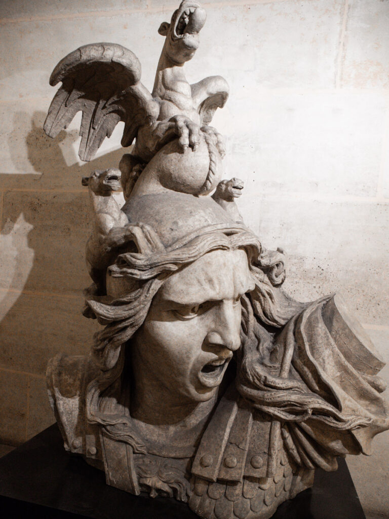 statue of woman's face battle crying