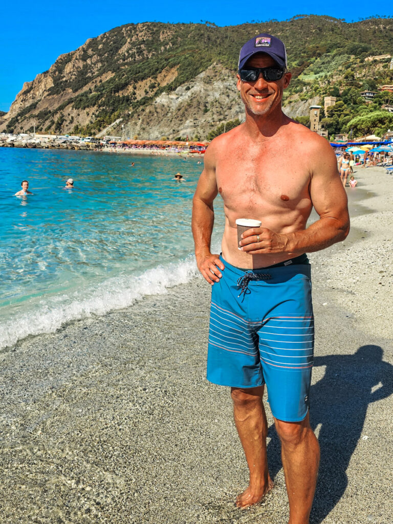 craig drinking coffee on beach