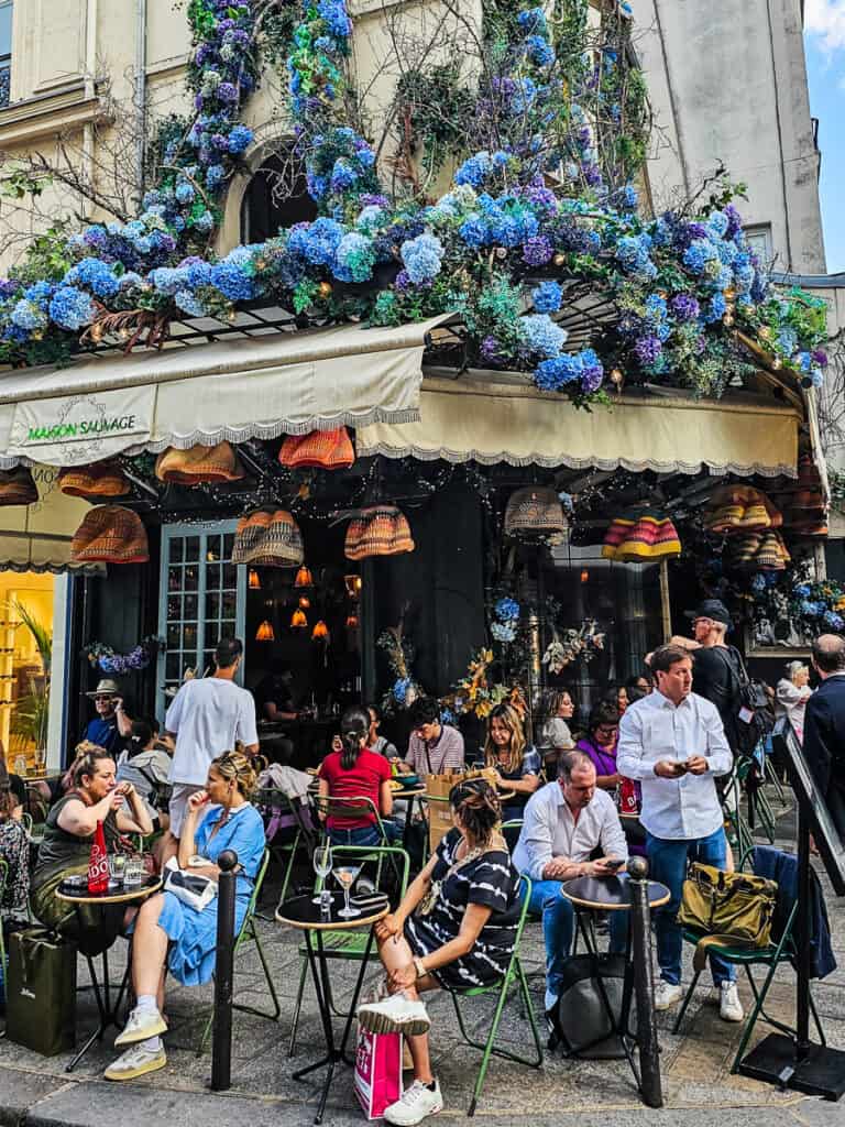 People sitting outside a cafe in Paris