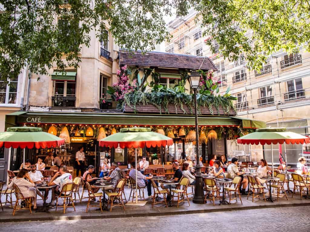 People sitting outside a cafe in Paris