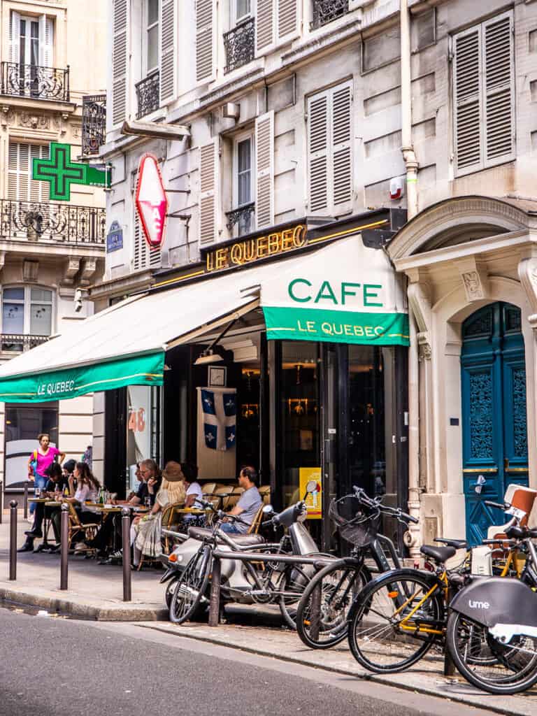 People and bikes outside a cafe in Paris