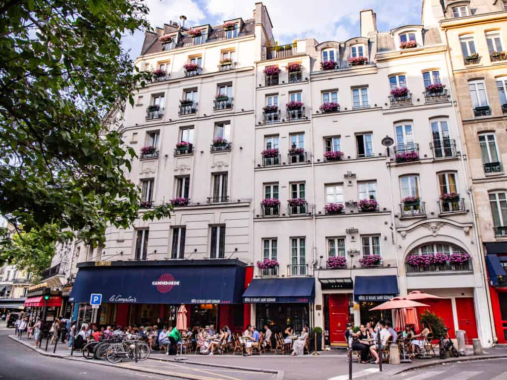 People sitting outside a cafe in Paris