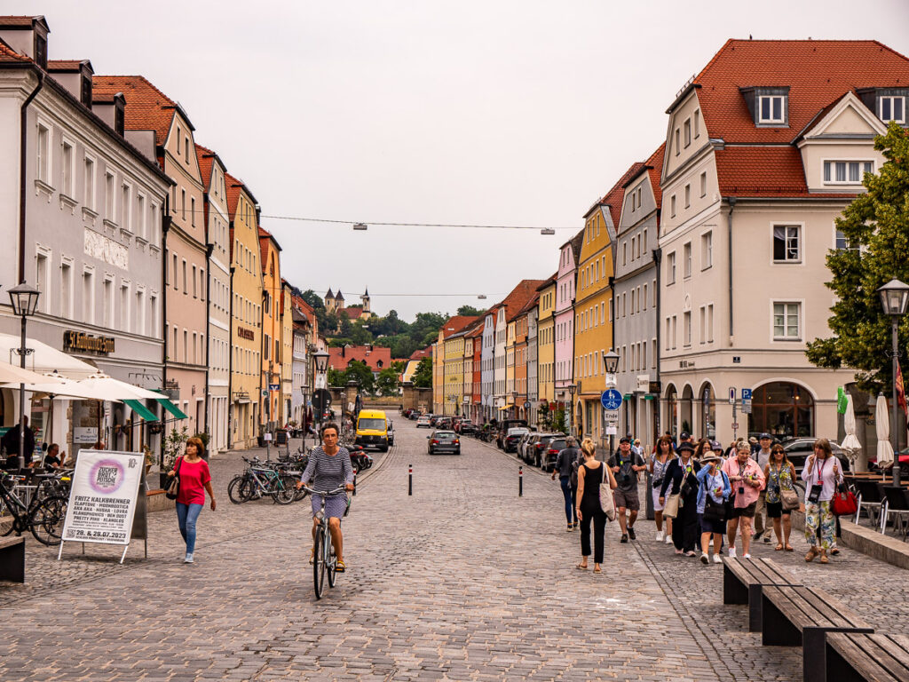 People walking and cycling along a city street