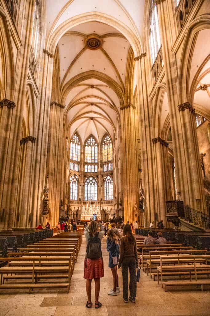 Mom and two daughters inside the cathedral in Regensburg