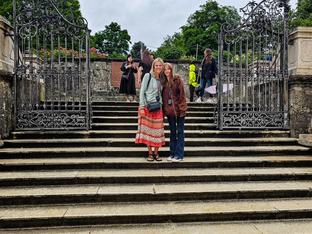 Mom and daughter standing on steps