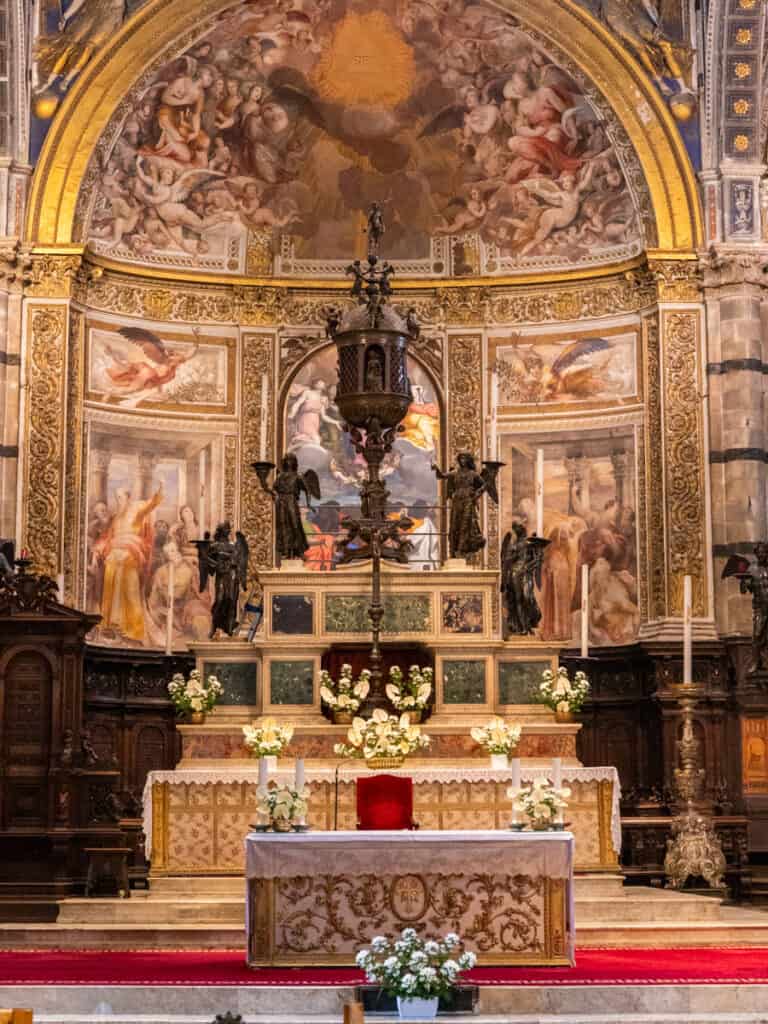 altar with paintings behind it