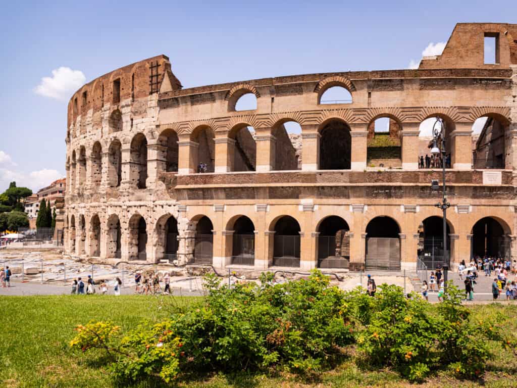 exterior of the colosseum with plants in front