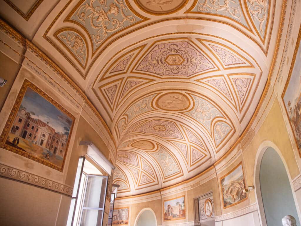 curved celling with frescoes inside the vatican museum