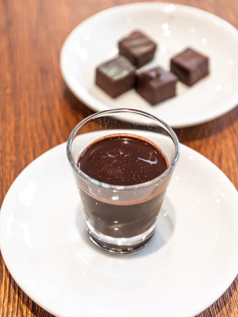 small glass of goldoni cold chocolate drink with chocolates