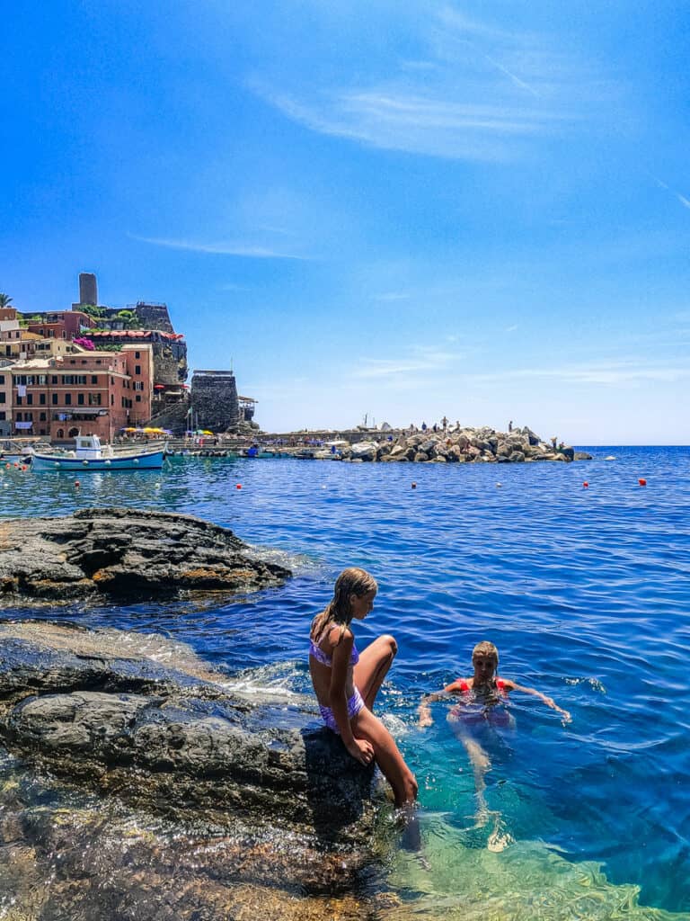 fgirl getting into water at vernazza