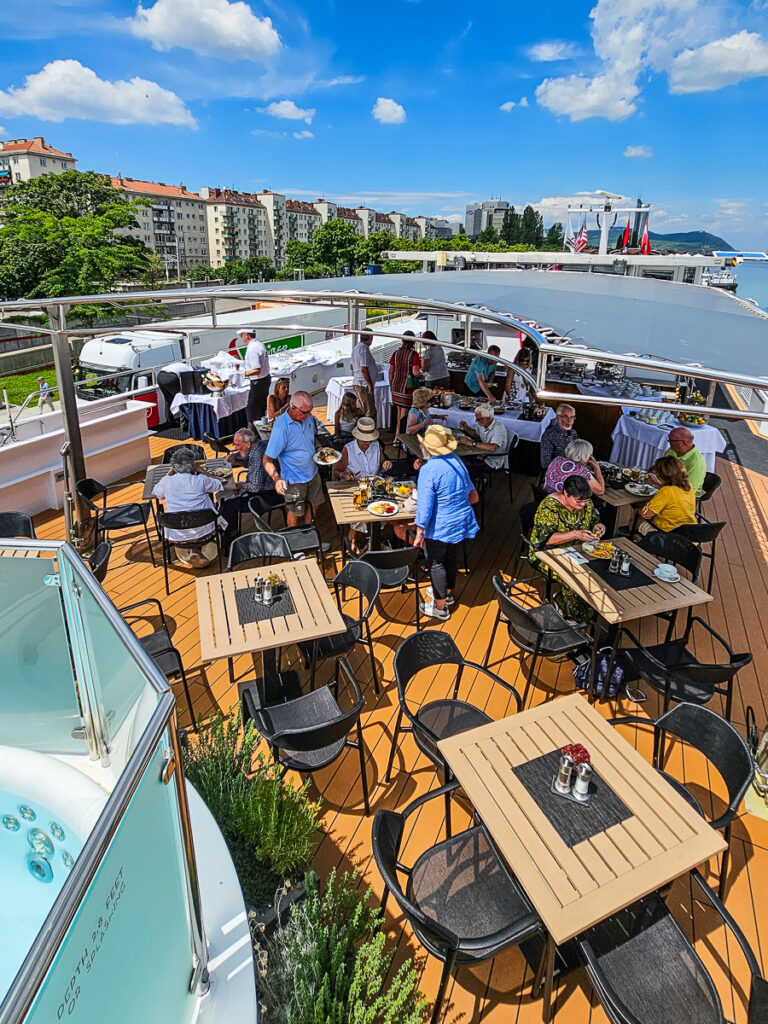 People having lunch on top of a cruise ship