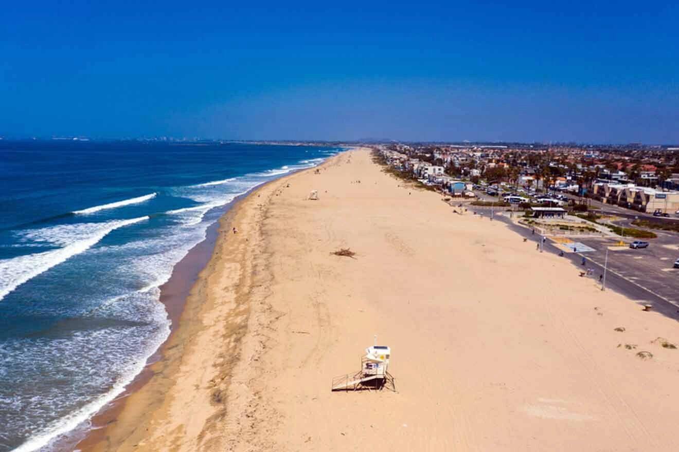 An aerial view of a beach with a lifeguard tower.