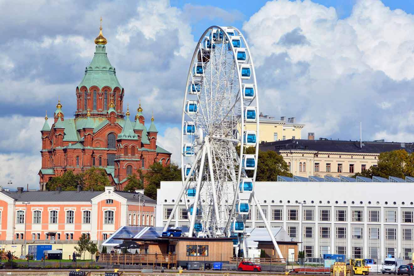 A ferris wheel in front of a church