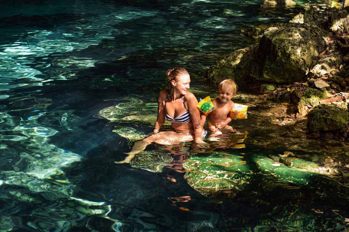 mom and son in a cenote