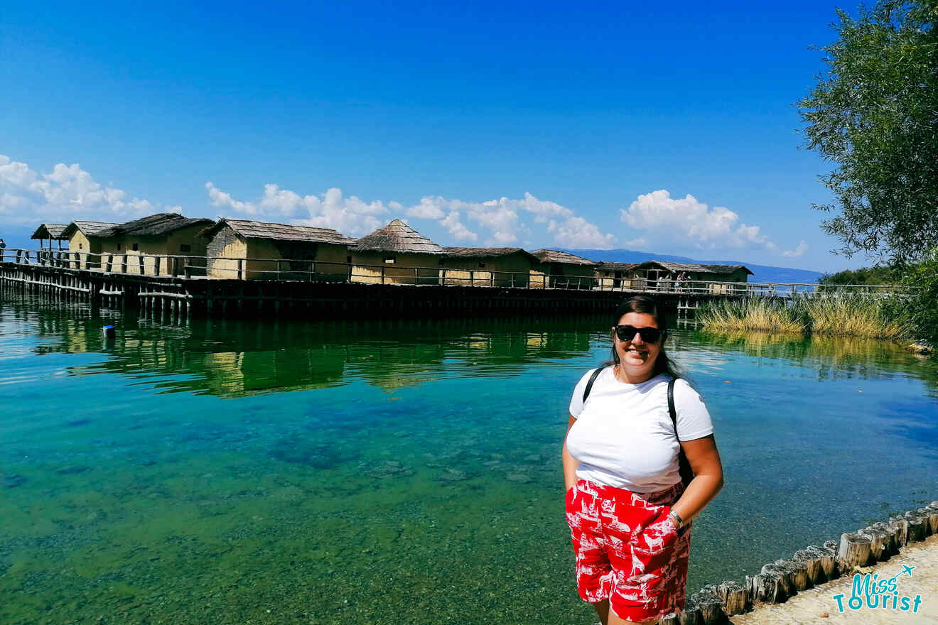 a girl posing in front of Bay of Bones, museum on water