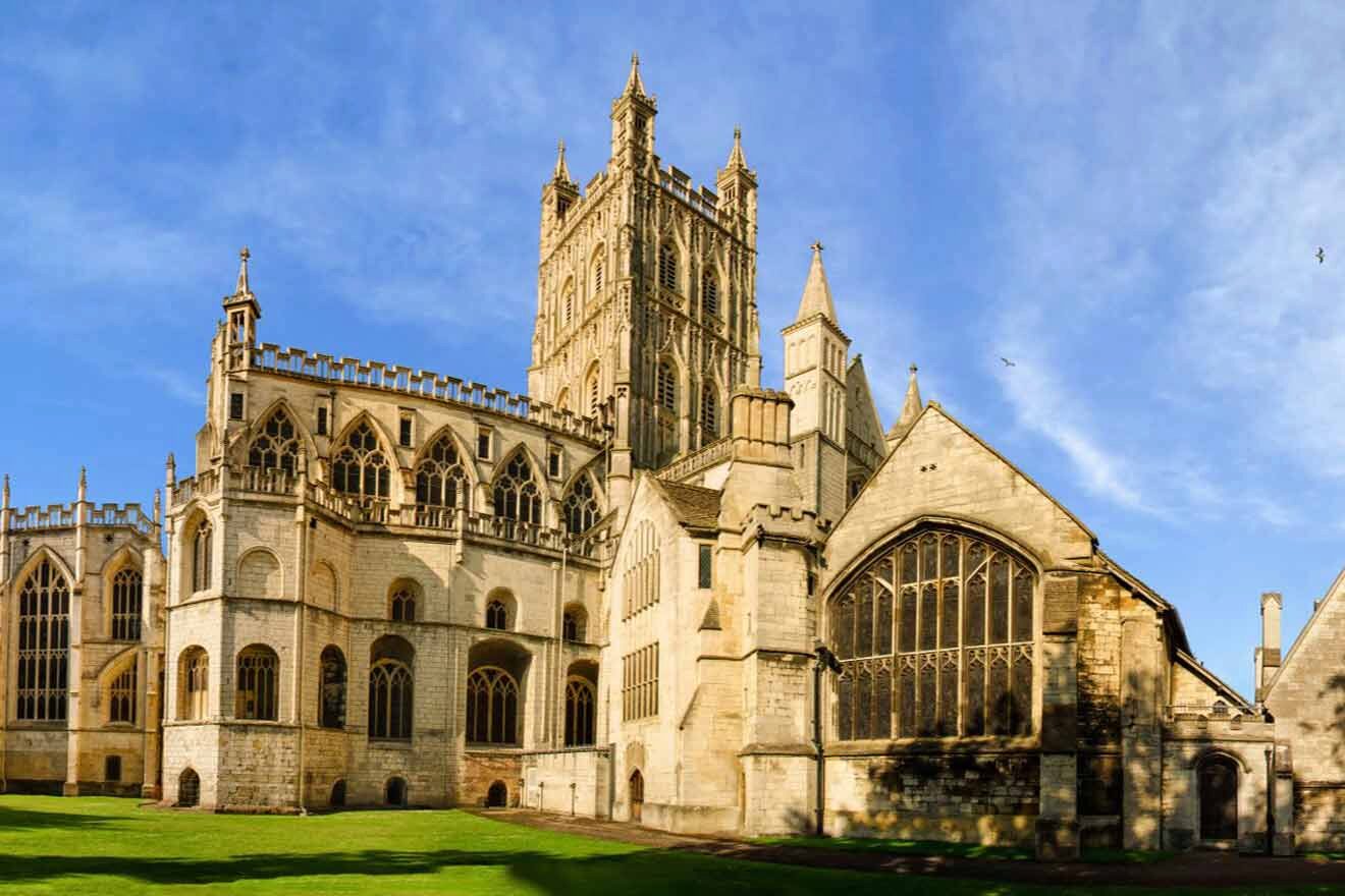 A large cathedral in the middle of a grassy field.