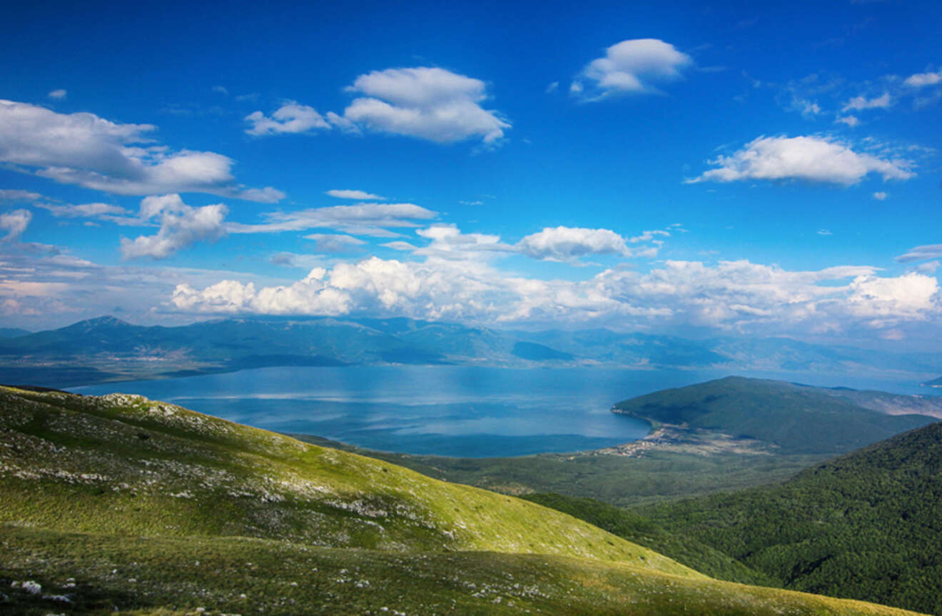 view of a lake from a mountain peak