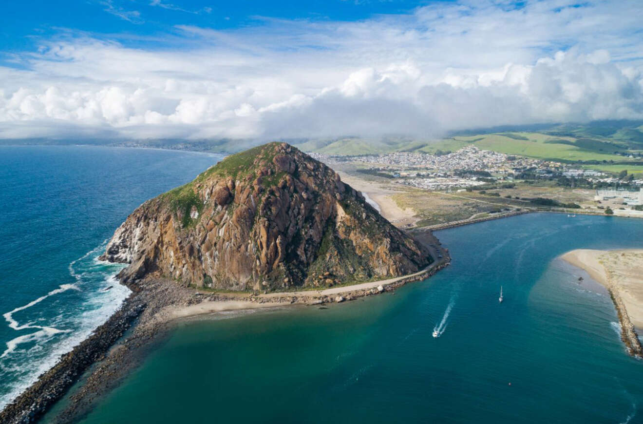 aerial view of a rock surrounded by water