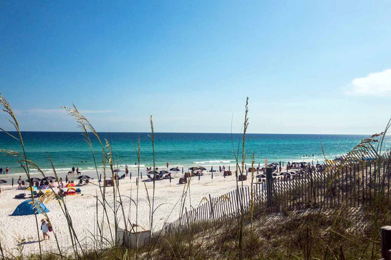 A beach with a lot of people and sand.