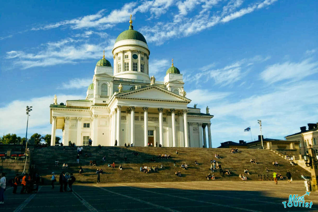 a large white building with columns and a dome on top