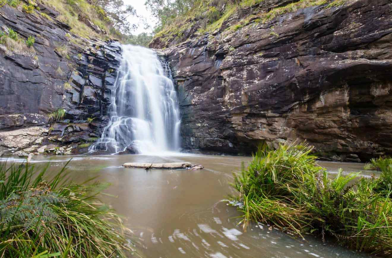 A waterfall in the middle of a rocky area.