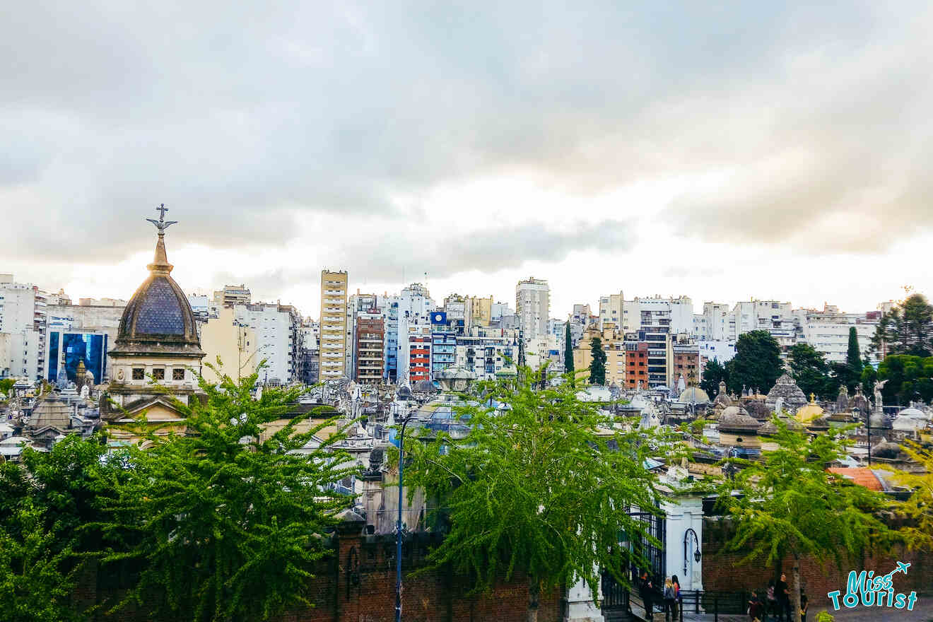 view of a city skyline with a cemetery in the foreground