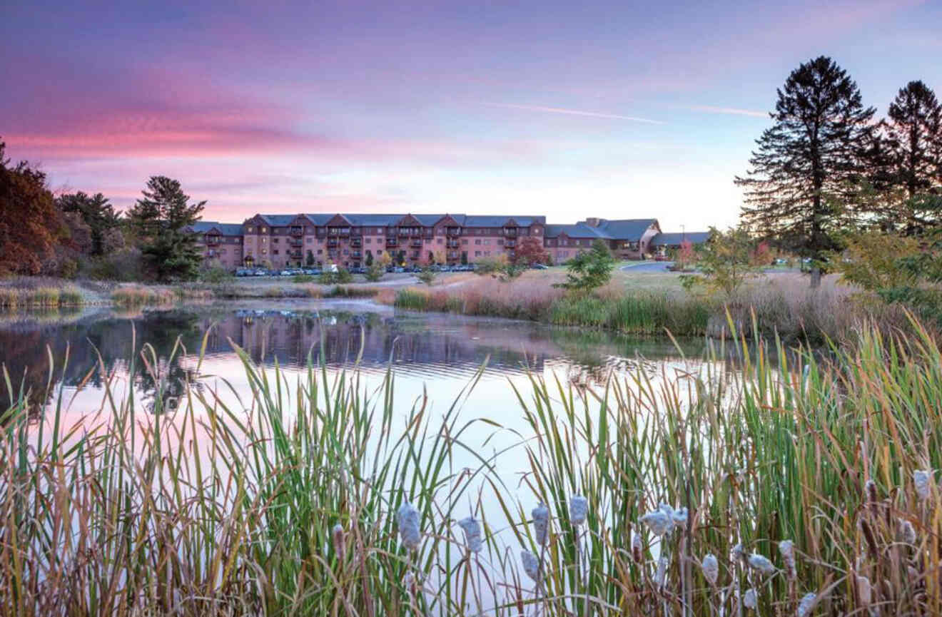 view of a lake and a building at sunset