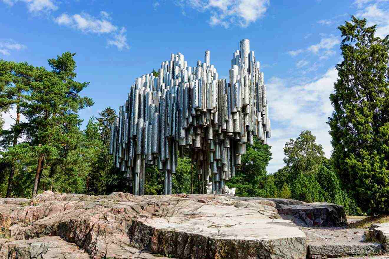 A large statue of a tree made of metal.