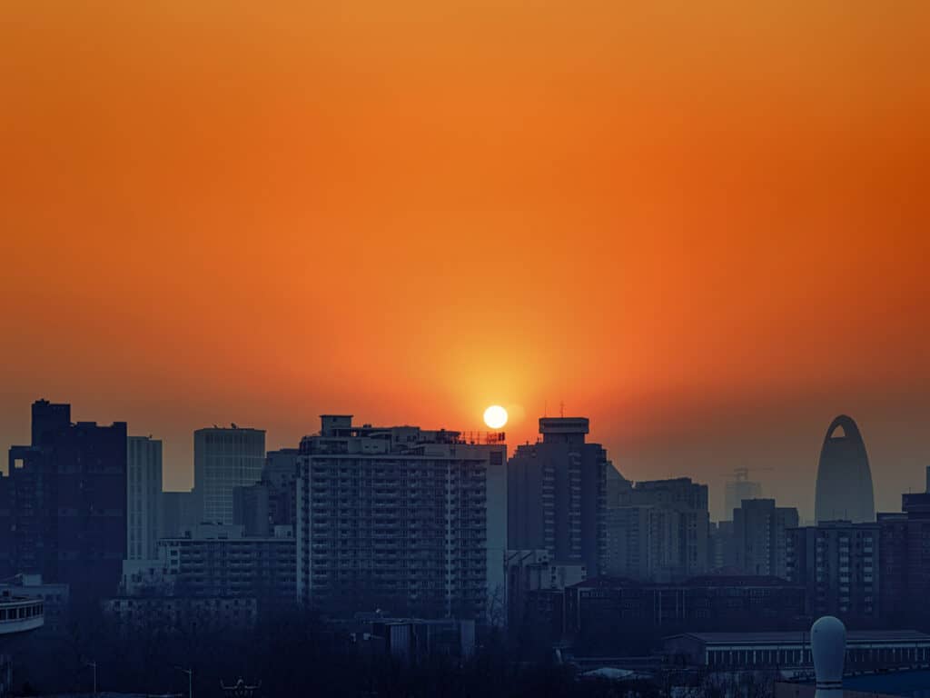 orange sunrise over beijing cityscape