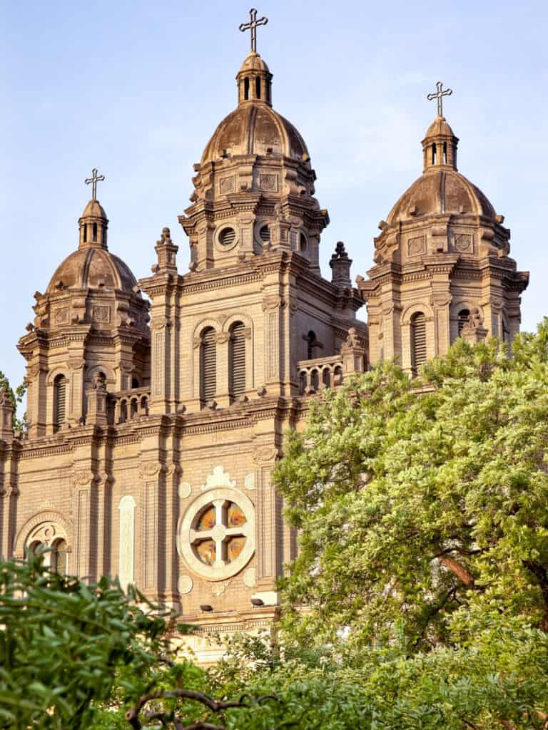 Basilica facade surrounded by Green Trees 