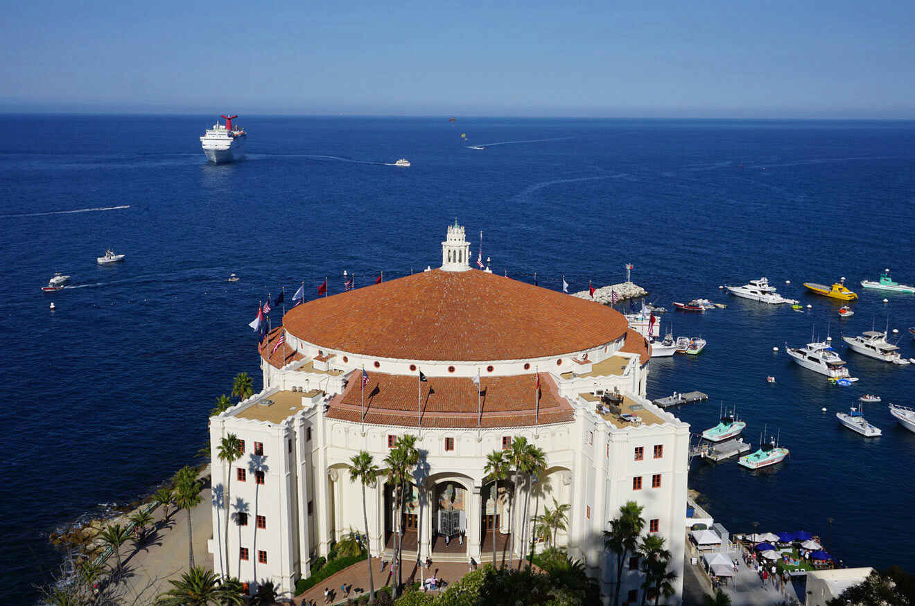 An aerial view of a building with boats in the water.