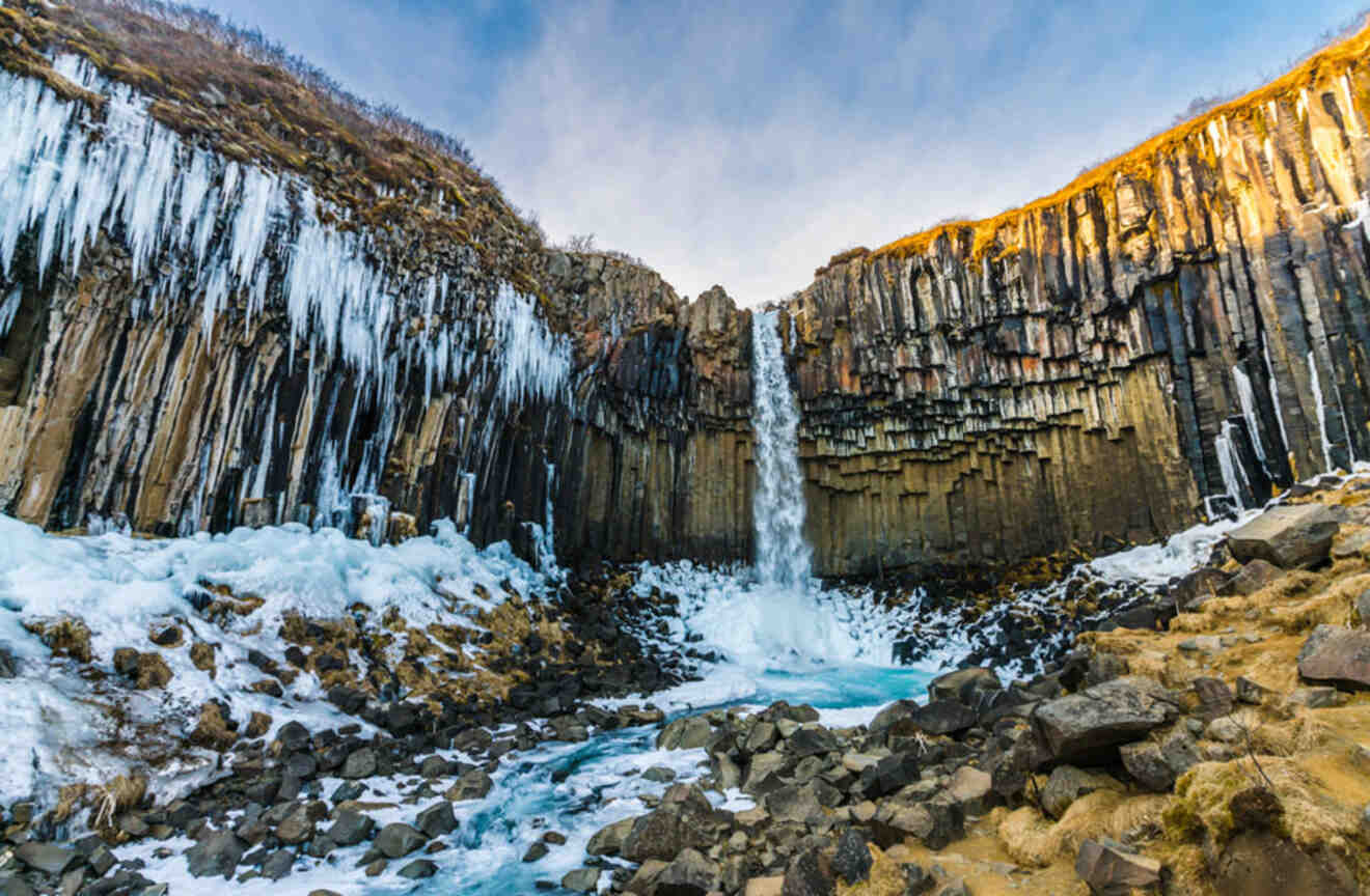 view of a waterfall falling from a cliff