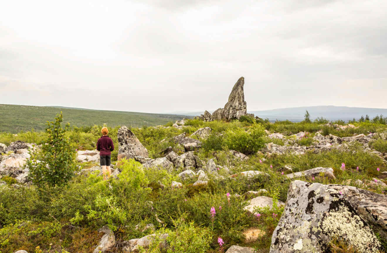 Woman standing in a remote mountain rocky area