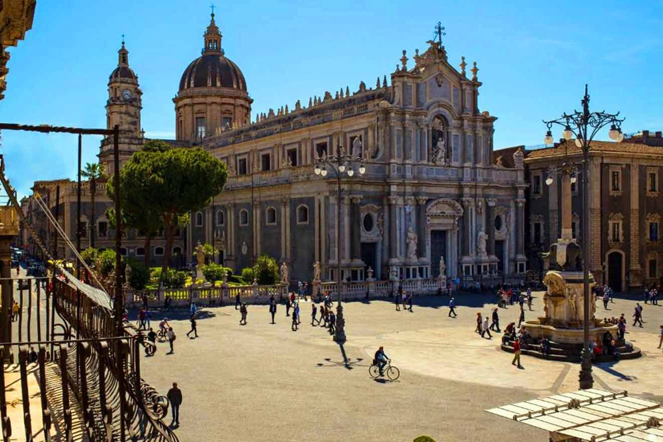 A view of a square with a church in the background.