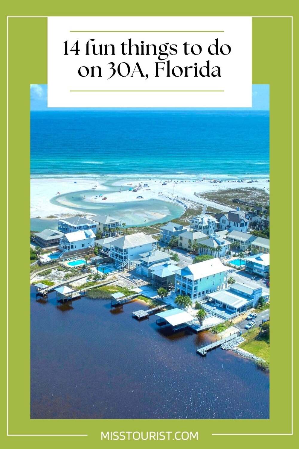 arial view over a beach with blue houses