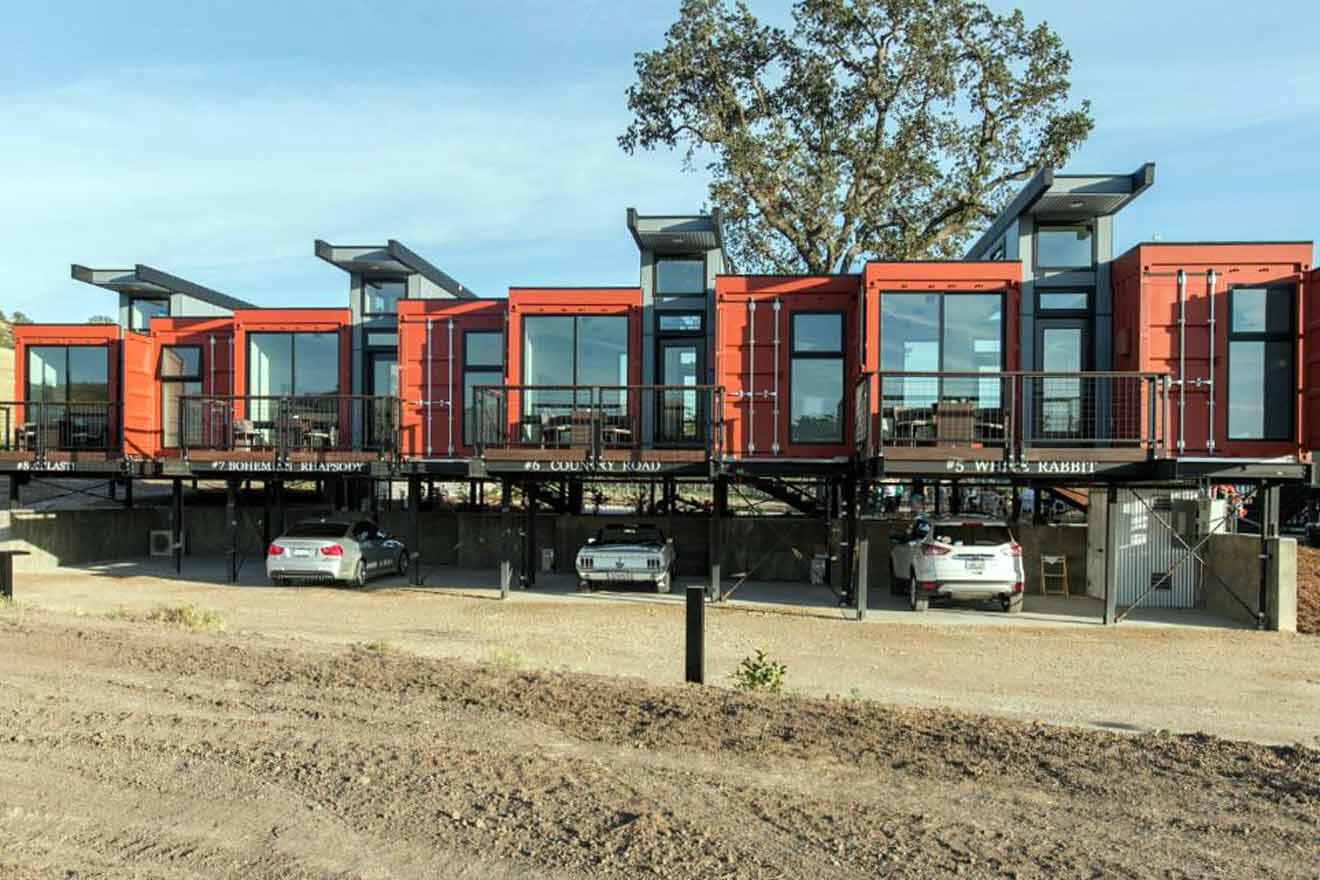 a suspended hotel's building with underneath parking space