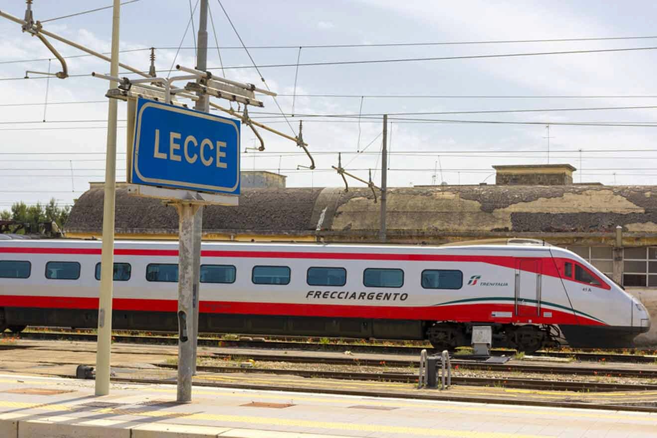 A red and white train at a train station.