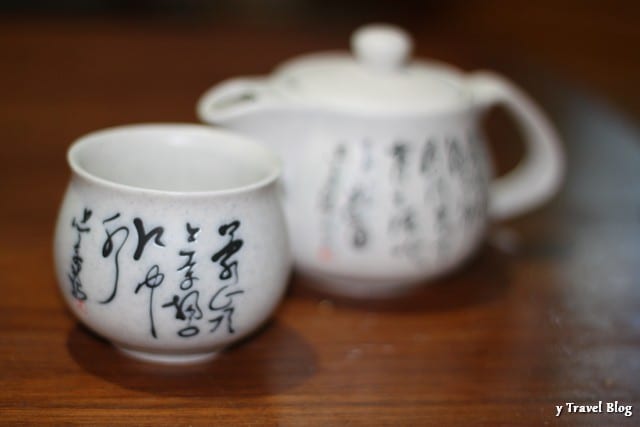 tea pot and cup on table